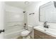Bathroom featuring tub/shower combo with white vanity at 5226 Fair Wind Ln, Charlotte, NC 28212