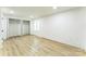 Bedroom with light hardwood floors, closet and one window providing natural light at 5226 Fair Wind Ln, Charlotte, NC 28212