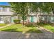 Townhouses with trees in front on a sunny day at 5226 Fair Wind Ln, Charlotte, NC 28212