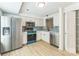 Updated kitchen features stainless steel appliances, light countertops and blue backsplash at 5226 Fair Wind Ln, Charlotte, NC 28212