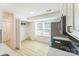 Bright kitchen area with stainless appliances and light countertops and eating area at 5226 Fair Wind Ln, Charlotte, NC 28212