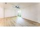 Spacious living room features sliding glass door and ceiling fan at 5226 Fair Wind Ln, Charlotte, NC 28212