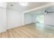 Spacious living room with light-toned hardwood floors and a ceiling fan at 5226 Fair Wind Ln, Charlotte, NC 28212