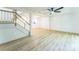 A modern living area with wood-look flooring and a ceiling fan at 5226 Fair Wind Ln, Charlotte, NC 28212