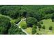 Aerial view of a home with extensive trees and greenery at 7016 Tirzah Rd, Waxhaw, NC 28173