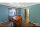 Dining room with hardwood floors, table, chairs and plenty of natural light at 7016 Tirzah Rd, Waxhaw, NC 28173