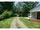 Gravel driveway leading to a home with mature trees and ample parking at 7016 Tirzah Rd, Waxhaw, NC 28173