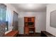 Office space with built in wooden desk and drawers, bright window, neutral wall color, and hardwood floors at 7016 Tirzah Rd, Waxhaw, NC 28173