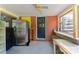 Sunroom with exposed brick, refrigerator, outdoor access, and a tile table at 7016 Tirzah Rd, Waxhaw, NC 28173