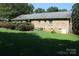 Expansive backyard featuring a well-maintained lawn and mature landscaping, perfect for outdoor enjoyment at 7017 Knightswood Dr, Charlotte, NC 28226