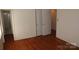 Bedroom with hardwood floors and ample closet space at 7017 Knightswood Dr, Charlotte, NC 28226
