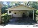 Carport with exterior with side yard and storage, perfect for parking and outdoor projects at 7017 Knightswood Dr, Charlotte, NC 28226