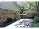 Home exterior with carport and brick facade showing outdoor space and home features at 7017 Knightswood Dr, Charlotte, NC 28226