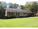 Well-maintained brick home with lush lawn, presenting a charming exterior and inviting curb appeal at 7017 Knightswood Dr, Charlotte, NC 28226