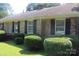 Charming brick home with manicured landscaping, offering curb appeal and classic design at 7017 Knightswood Dr, Charlotte, NC 28226
