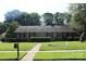 Classic brick home with manicured lawn, showcasing a welcoming exterior and well-maintained landscaping at 7017 Knightswood Dr, Charlotte, NC 28226