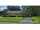 Charming brick home with mature landscaping and a convenient covered parking area at 7017 Knightswood Dr, Charlotte, NC 28226