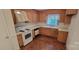 Practical kitchen featuring essential appliances and a well-lit sink area at 7017 Knightswood Dr, Charlotte, NC 28226