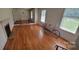 Spacious living room featuring hardwood floors, a fireplace, and ample natural light at 7017 Knightswood Dr, Charlotte, NC 28226