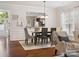 Cozy dining room adjacent to living area, featuring hardwood floors and ample natural light at 8036 Crater Lake Dr, Fort Mill, SC 29707