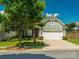 Charming home features a well-manicured front yard and a two-car garage, creating a welcoming curb appeal at 8036 Crater Lake Dr, Fort Mill, SC 29707