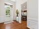 Open-concept foyer with views of the kitchen and a decorative plant stand adding to the home's decor at 8036 Crater Lake Dr, Fort Mill, SC 29707