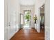 Inviting foyer with hardwood floors and a large window above the front door allowing natural light into the house at 8036 Crater Lake Dr, Fort Mill, SC 29707