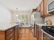 Kitchen featuring stainless steel appliances, a granite countertop island and an adjacent breakfast area filled with natural light at 8036 Crater Lake Dr, Fort Mill, SC 29707