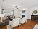 Bright living room featuring hardwood floors, a fireplace, and lots of natural light at 8036 Crater Lake Dr, Fort Mill, SC 29707