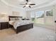 Spacious bedroom features soft carpet, a ceiling fan, and an abundance of natural light at 8036 Crater Lake Dr, Fort Mill, SC 29707