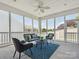 Inviting screened porch with modern furniture and views of the backyard and landscaping at 8036 Crater Lake Dr, Fort Mill, SC 29707