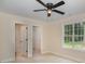 Bedroom featuring a ceiling fan, bright window, an ensuite bathroom and a walk-in closet at 903 Brookdale St, Kannapolis, NC 28083