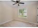 Bright bedroom with light wood floors and a ceiling fan at 903 Brookdale St, Kannapolis, NC 28083