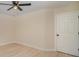 Bedroom with modern ceiling fan, light wood floor, and bright window at 903 Brookdale St, Kannapolis, NC 28083