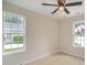 Bedroom featuring a ceiling fan and two bright windows at 903 Brookdale St, Kannapolis, NC 28083