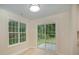 Bright dining area with large windows and sliding glass door to outdoor space at 903 Brookdale St, Kannapolis, NC 28083
