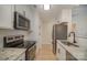 Bright kitchen with stainless steel appliances, granite countertops and white cabinetry for ample storage at 903 Brookdale St, Kannapolis, NC 28083