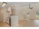 Well-lit kitchen with stainless steel appliances, granite countertops and open layout to the living area at 903 Brookdale St, Kannapolis, NC 28083
