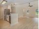Bright living room featuring hardwood floors, stainless steel appliances, and an open layout to the kitchen at 903 Brookdale St, Kannapolis, NC 28083