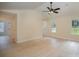 Spacious living area showcasing hardwood floors, natural light, ceiling fan and neutral paint palette at 903 Brookdale St, Kannapolis, NC 28083