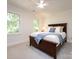 This bedroom has carpet and neutral walls with two windows for lots of natural light at 9415 Braemar Ter, Charlotte, NC 28210