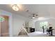Finished bonus room featuring a teepee, desk, ceiling fans, and a large window at 9415 Braemar Ter, Charlotte, NC 28210