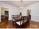 An elegant dining room features hardwood floors and a chandelier at 9415 Braemar Ter, Charlotte, NC 28210