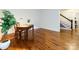 Room featuring hardwood floors and natural light, near a staircase at 9415 Braemar Ter, Charlotte, NC 28210