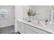 Bathroom with double vanity, white countertop and cabinets, and decorative accents at 1043 20Th Avenue Se Loop, Hickory, NC 28602