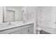 Bright bathroom with double sinks, white cabinets, and a separate tub/shower area at 1043 20Th Avenue Se Loop, Hickory, NC 28602