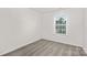 This bedroom features neutral walls, carpet flooring, and a window with natural light at 1043 20Th Avenue Se Loop, Hickory, NC 28602