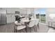 Bright dining area connected to kitchen, featuring contemporary table setting and view of backyard at 1043 20Th Avenue Se Loop, Hickory, NC 28602