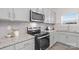Modern kitchen with stainless steel appliances, granite countertops, and gray cabinetry, designed for functionality at 1043 20Th Avenue Se Loop, Hickory, NC 28602