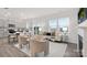 Spacious open-concept living area with large windows, stylish furniture, and seamless flow to the kitchen at 1043 20Th Avenue Se Loop, Hickory, NC 28602